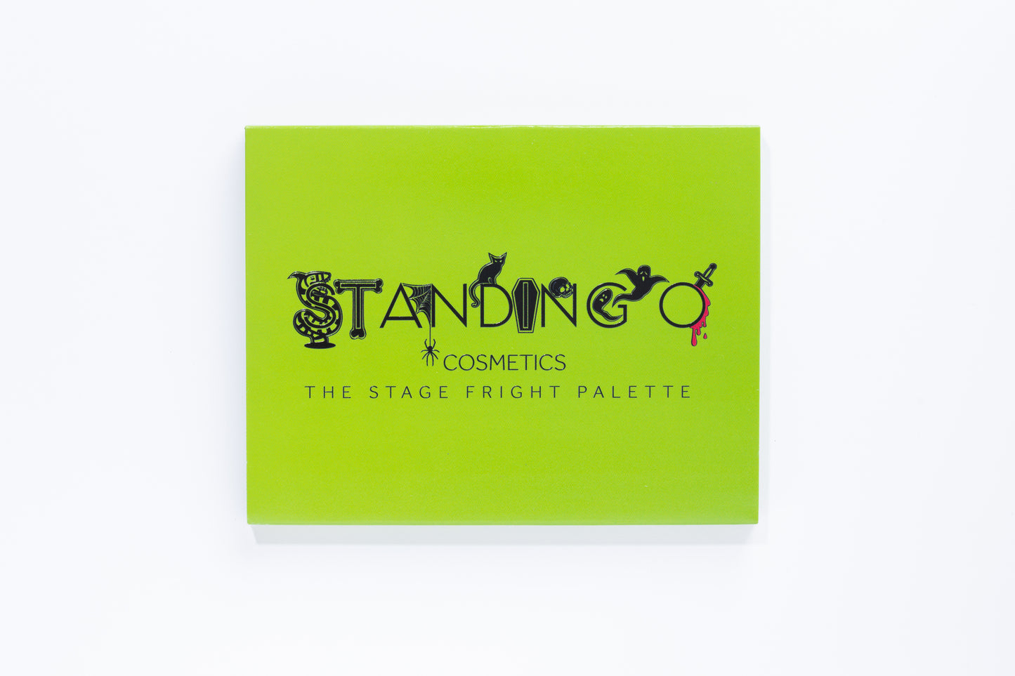 'The Stage Fright Palette' by Standing O Cosmetics, shown in slime green color. A spooky eye shadow palette with a Halloween logo.