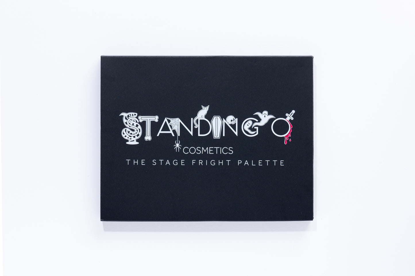 'The Stage Fright Palette' by Standing O Cosmetics, shown in black. A spooky eye shadow palette with a Halloween logo.