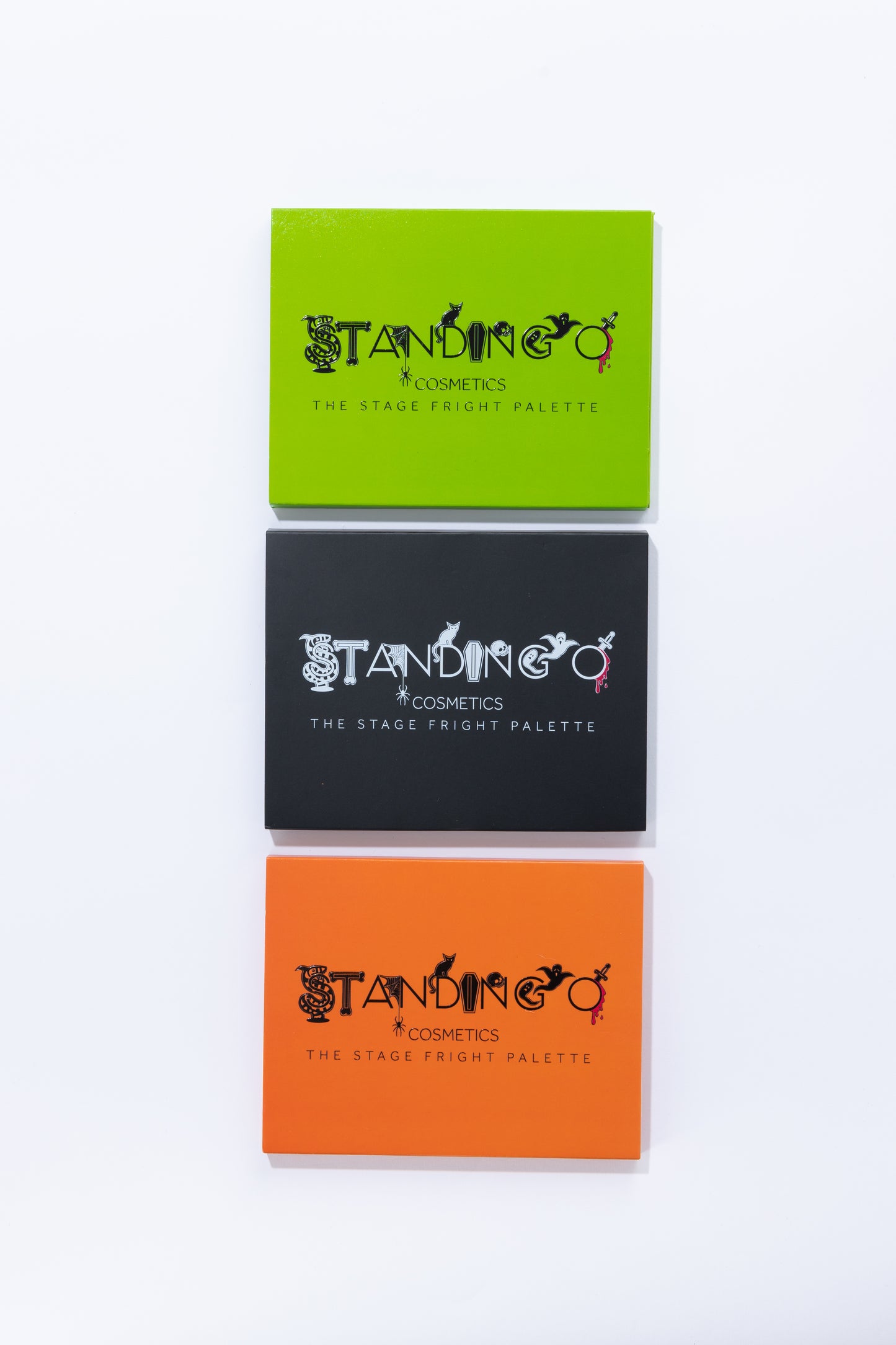 Three different color Halloween-themed eyeshadow palettes, showcasing halloween characters in the logo.