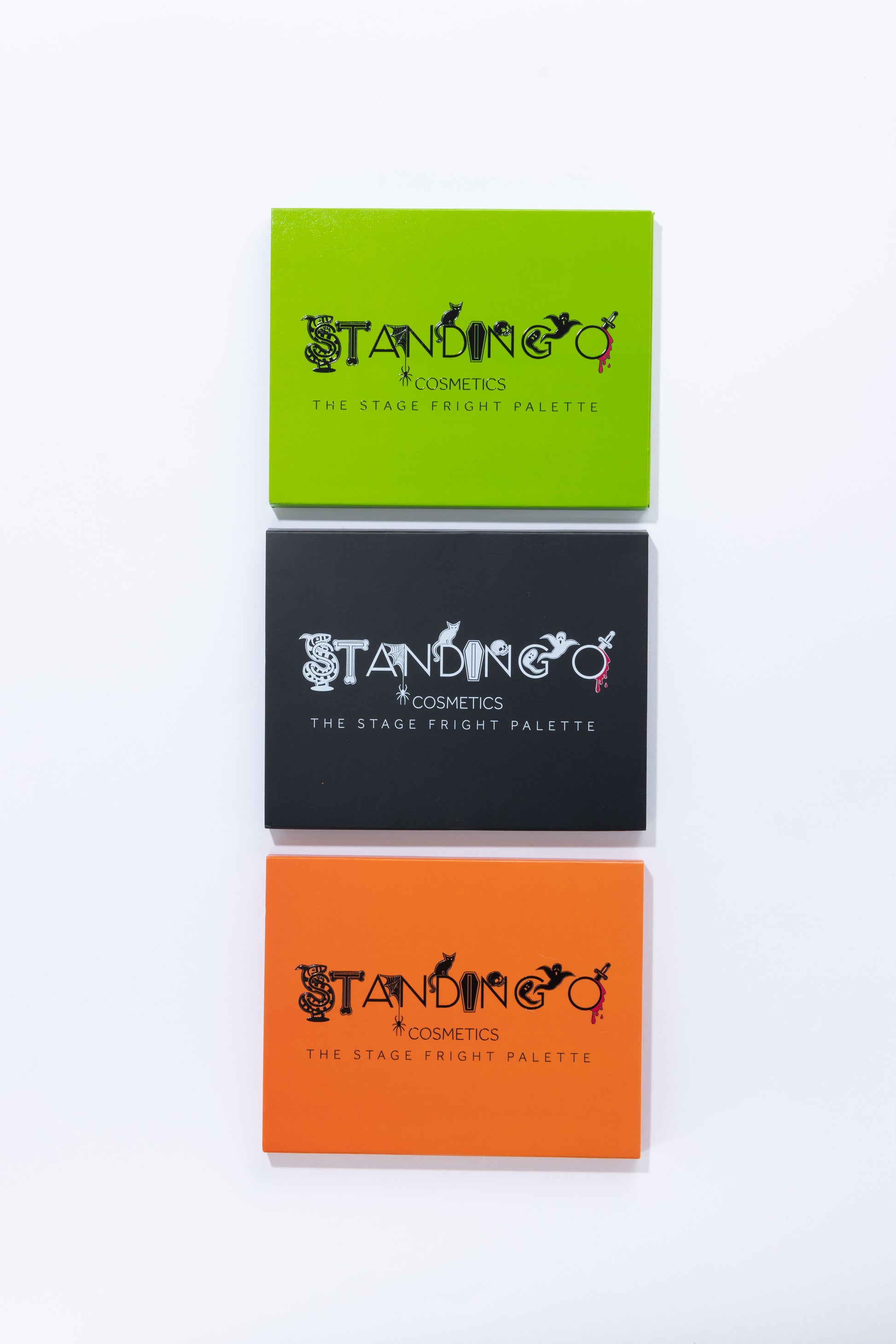 Three different color Halloween-themed eyeshadow palettes, showcasing halloween characters in the logo.