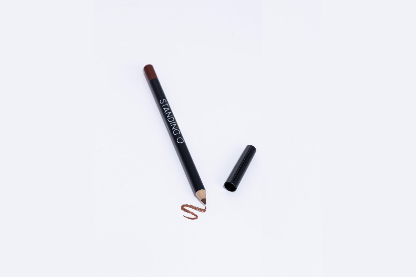 Lip liner pencil with swatch to showcase color of liner, brown liner.