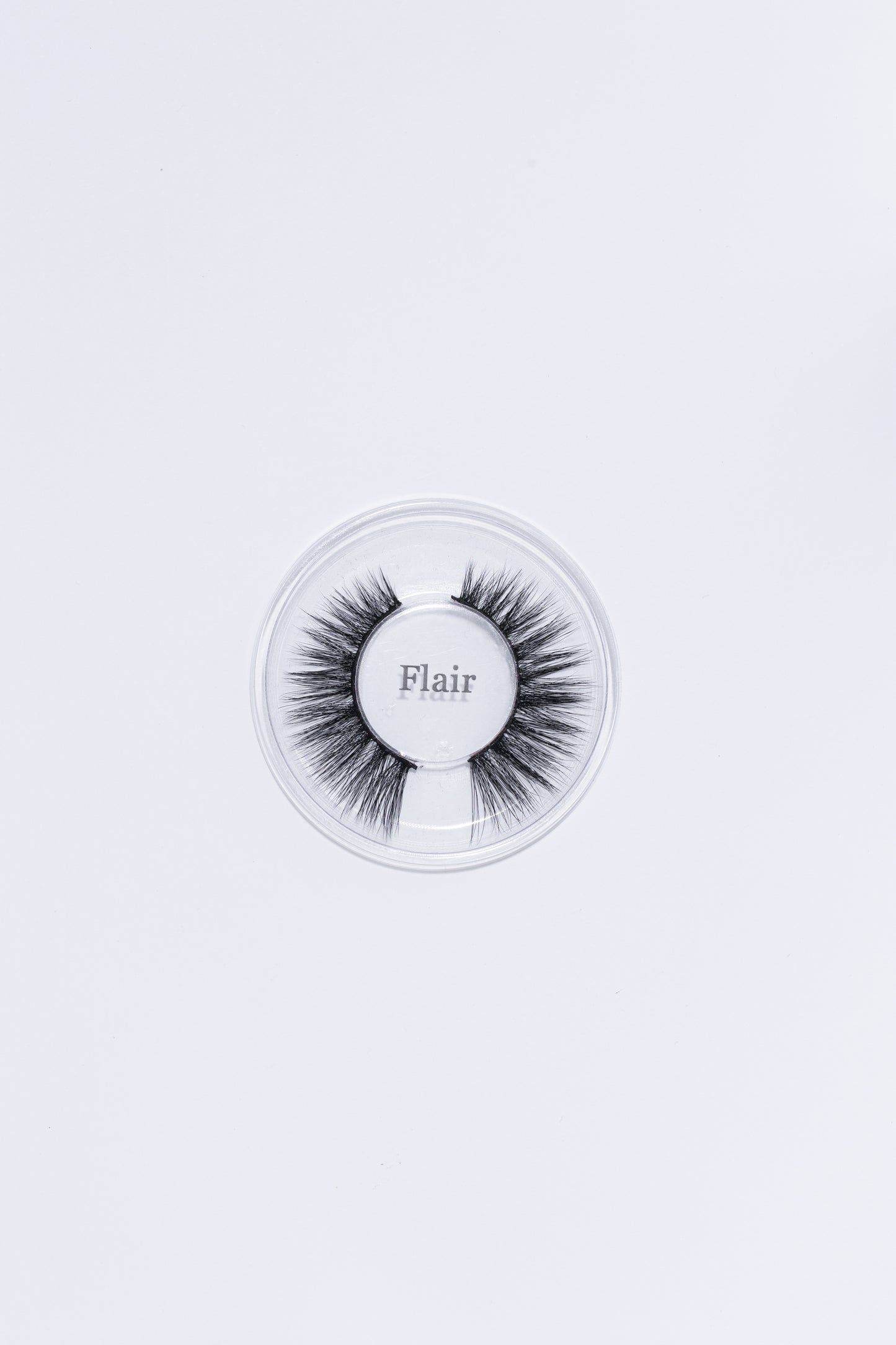 Flair Lash, laying on a white background.