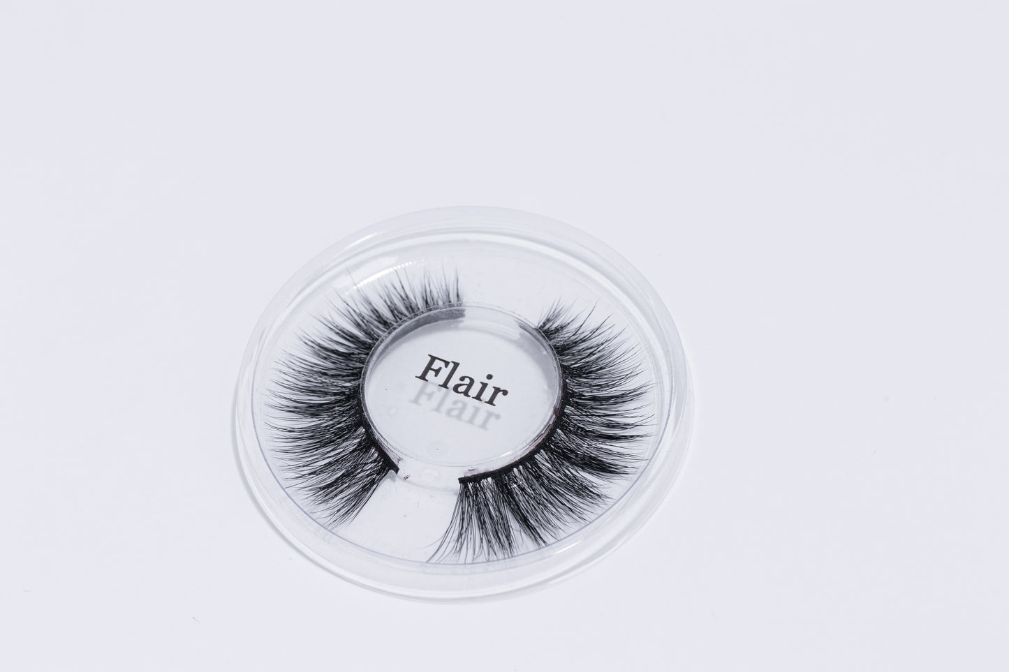 Flair Lash, laying on a white background.