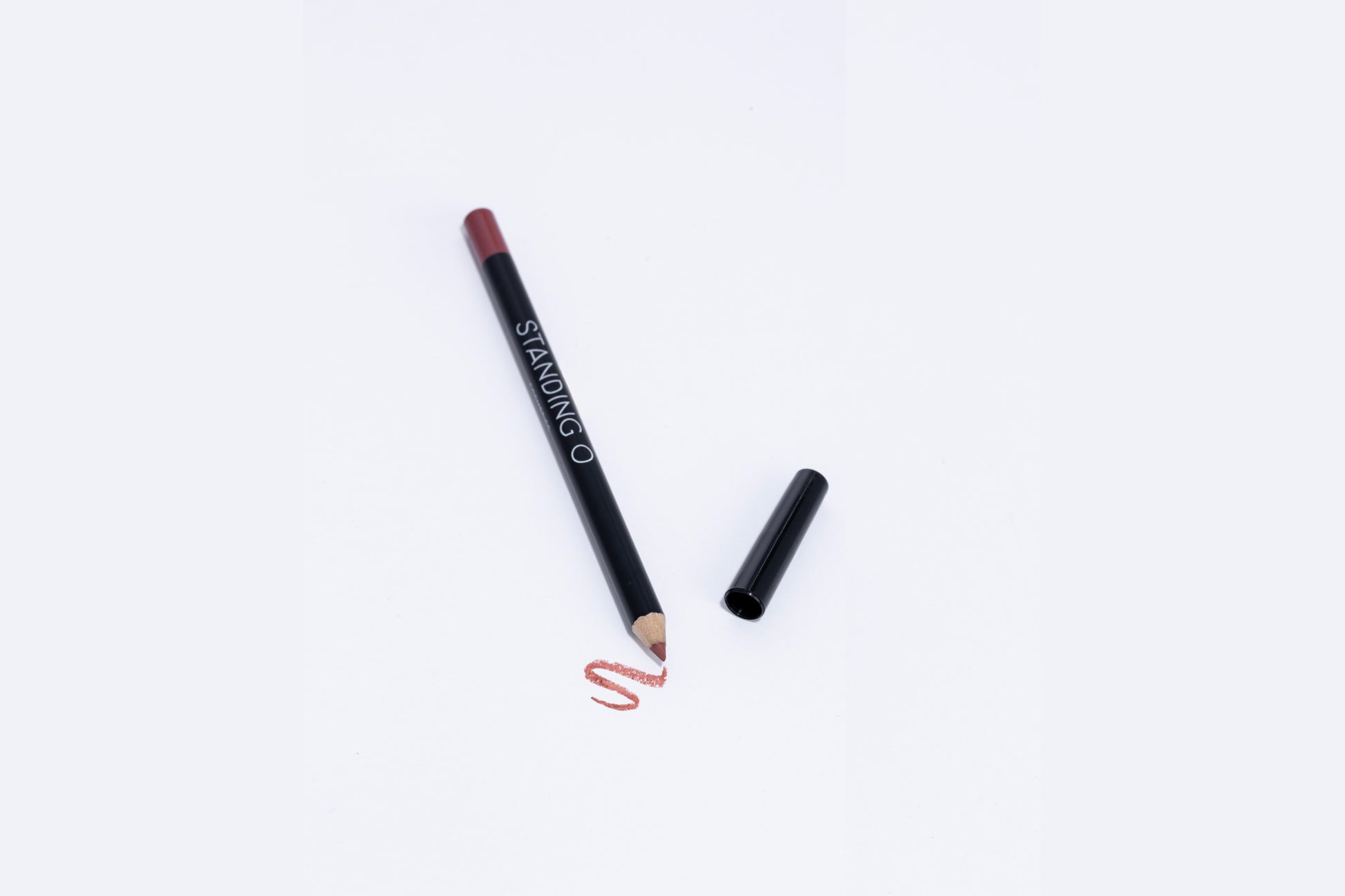 Lip liner pencil with swatch to showcase color of liner, rosey light nude red liner.