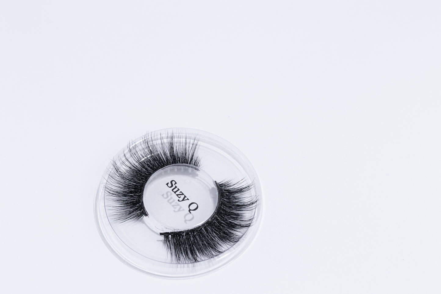 Suzy Q Lash, laying on a white background.