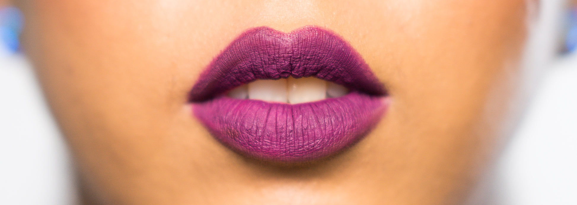 matte liquid lipstick & lip liner pencil shown on model in dark purple