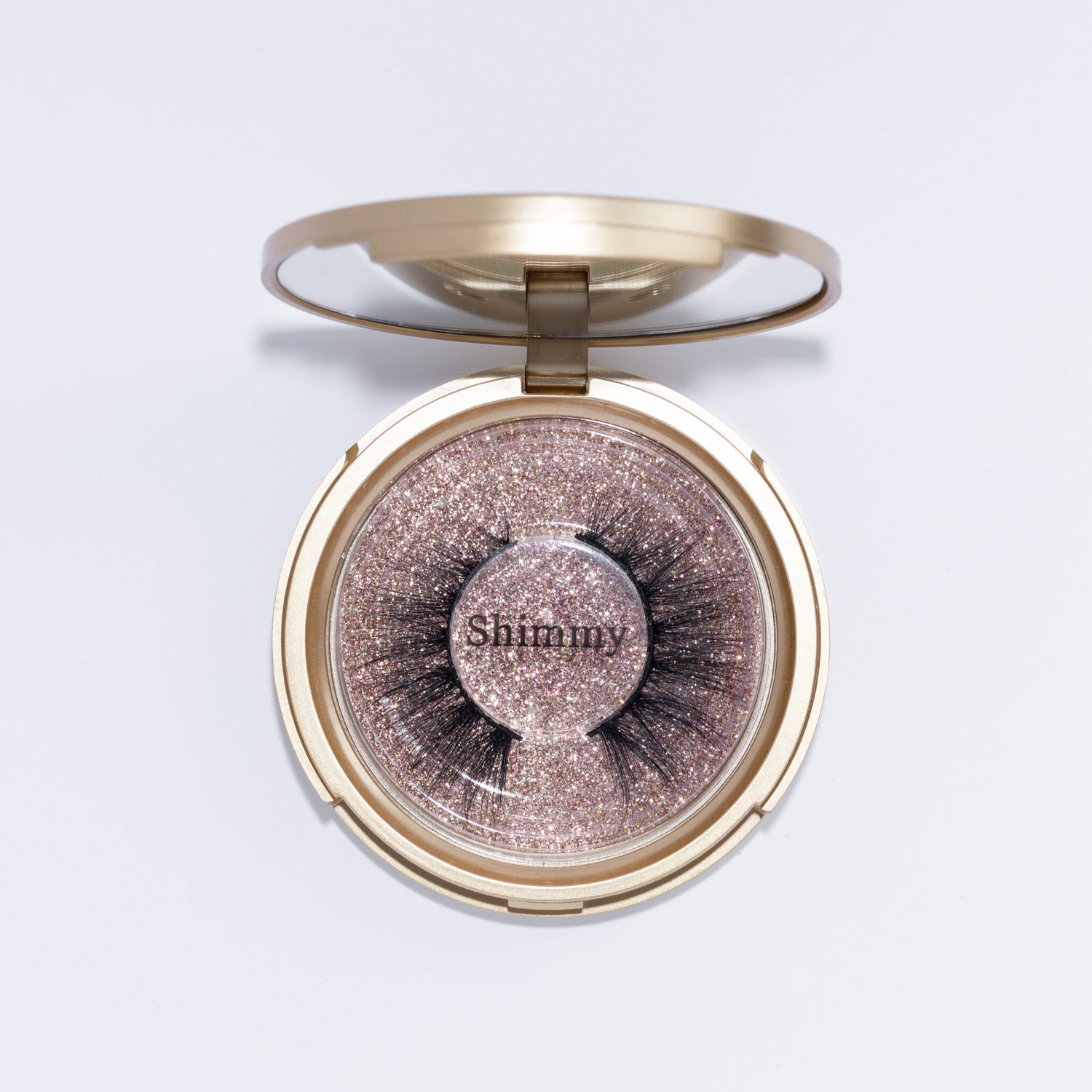 Classic gold Compact with lash style: Shimmy. 