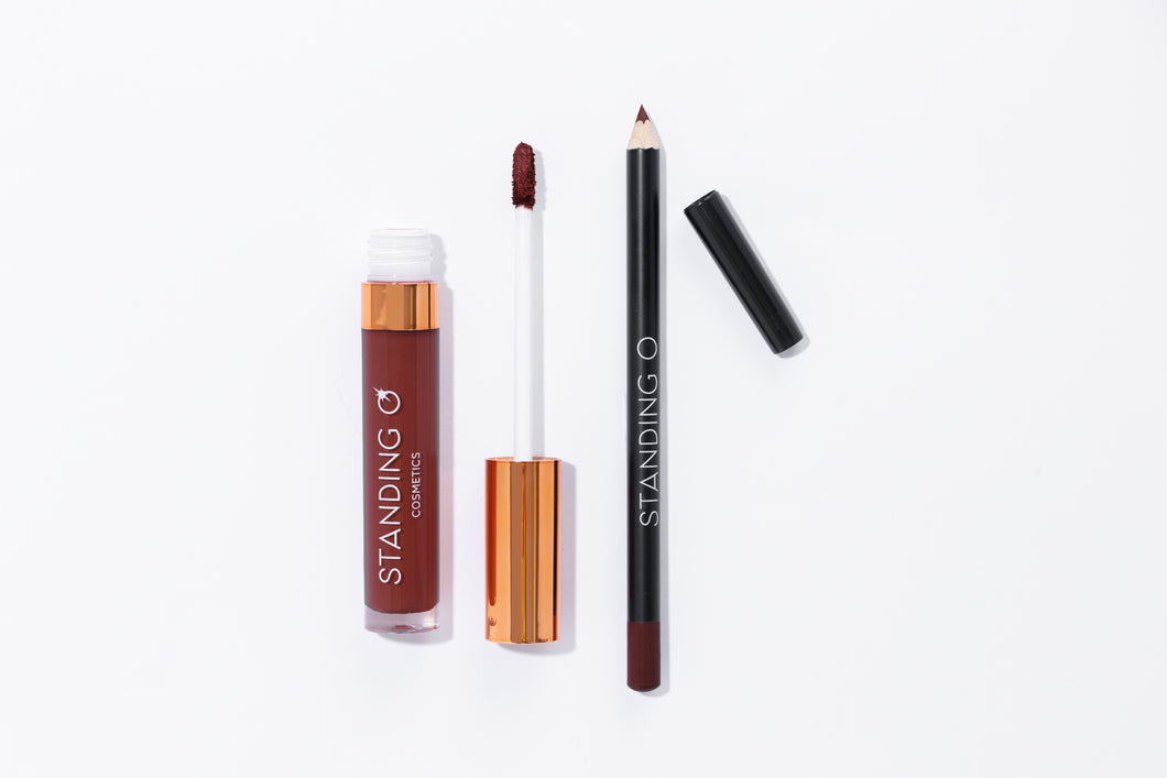 Duo flat lay, including: the matte liquid lipstick and liner, shown without the tops to showcase color: dark burgundy shade.