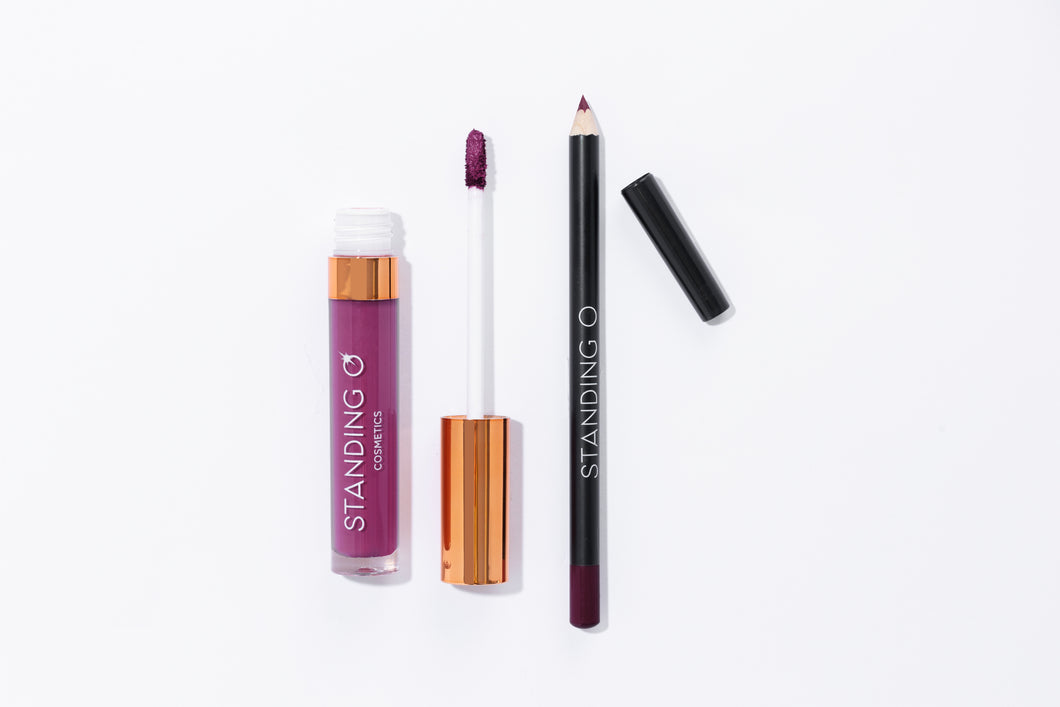Duo flat lay, including: the matte liquid lipstick and liner, shown without the tops to showcase color: deep purple shade.
