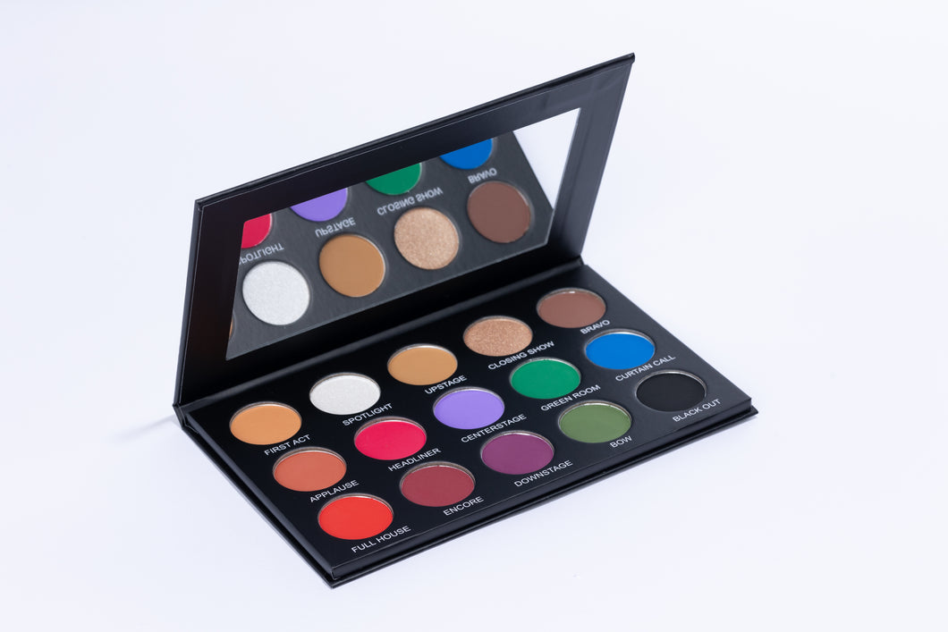 15 Pan Eye shadow palette. Colors shown: red, pink, burgundy, eggplant, lavender, kelly green, army army, blue, black and a variety of neutral browns.