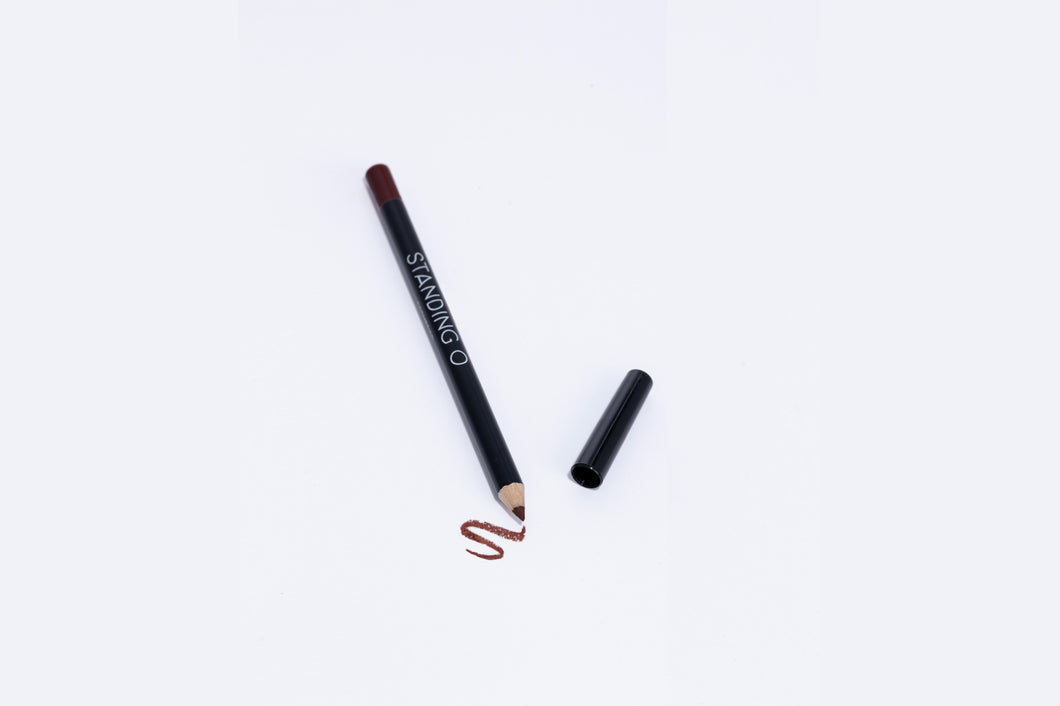 Lip liner pencil with swatch to showcase color of liner, dark burgundy liner.