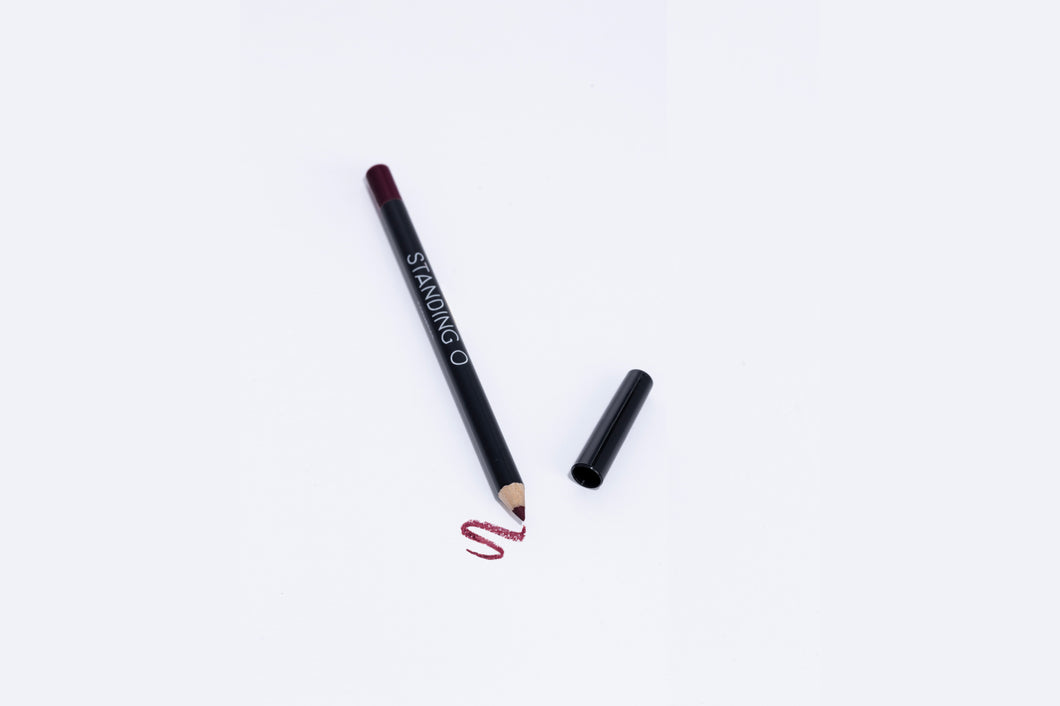 Lip liner pencil with swatch to showcase color of liner, dark purple liner..