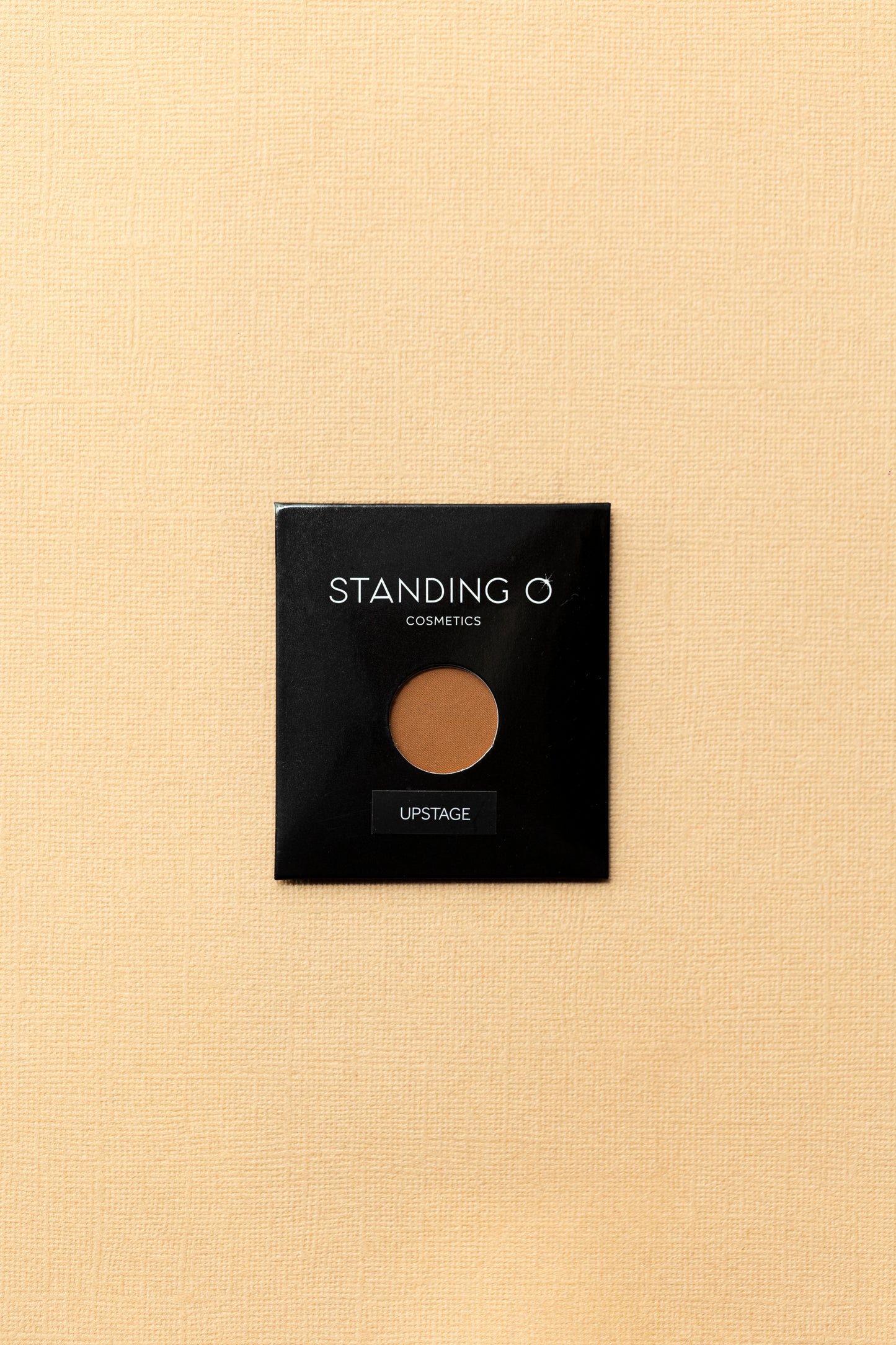 Discover the allure of 'Standing O' single eyeshadow in shade 'Upstage', offering a rich and intense color payoff.